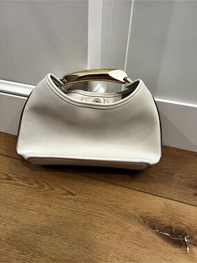 White small bag with gold handle